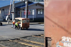 Lloyd and Ralph push the speeder across street after it failed to move under its own power. Flangeways full of debris got in the way of good traction.